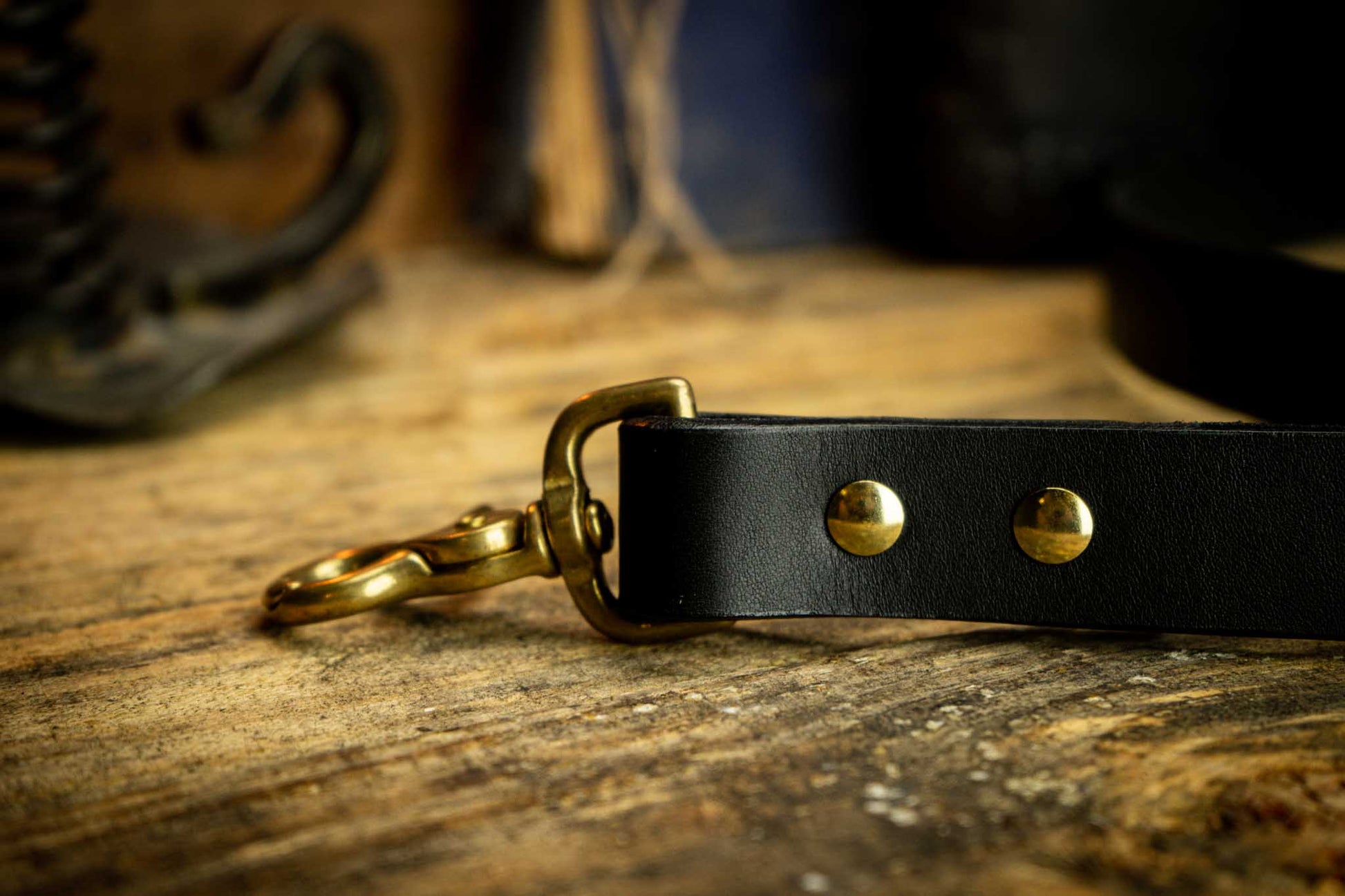 black dog leash with gold accents